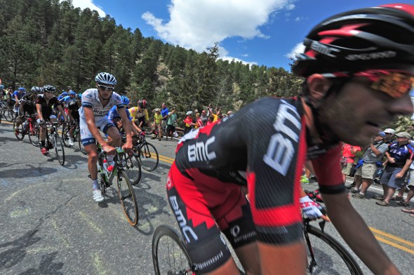 The Peloton buzzes around a switchback above Glen Haven on Saturday. The ability to get close to the riders drew around 700 fans to the last KOM climb outside of Estes Park.