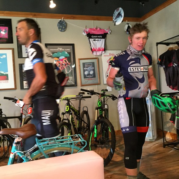 Josh Cramer, left, owner/operator of Notch Top Coffee, and high school cyclist Jeremy Norris, mill about Via Bicycle Cafe last fall. The shop is as much about the cycling community as it is the bikes.