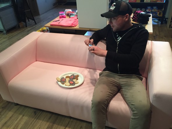 Stef sits on what has become his shop's trade mark pink couch. As his name implies, Tomasello is Italian, by heritage, and loves the iconic hue of the Giro d'Italia.