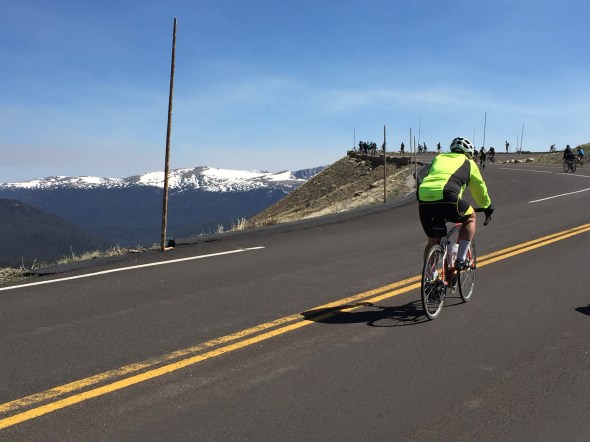 A rider climbs toward Medicine Bow Curve on Trail Ridge Road.